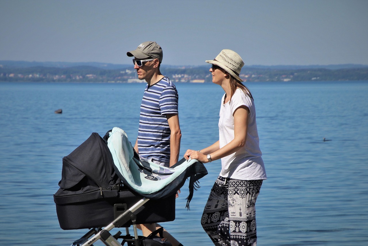 bassinet pram being pushed by parents